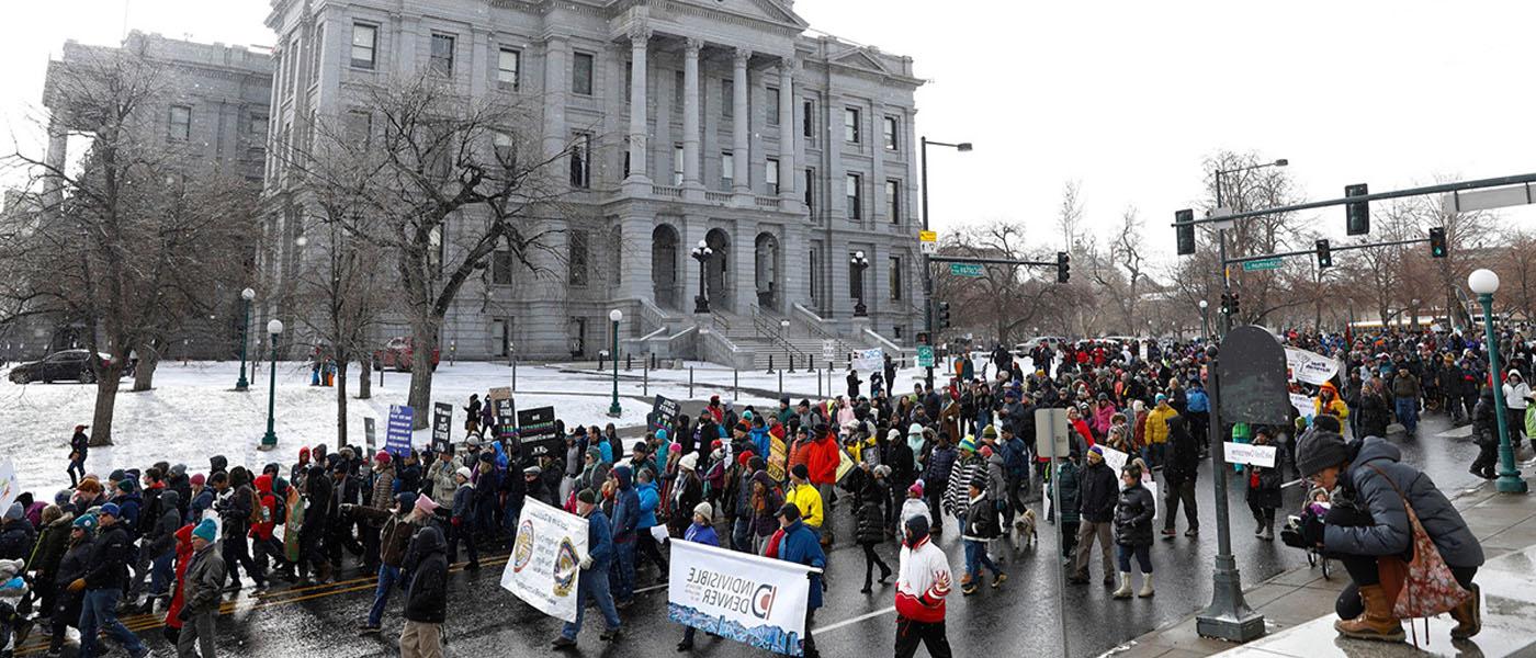 Denver MLK Marade marching on a snowy day