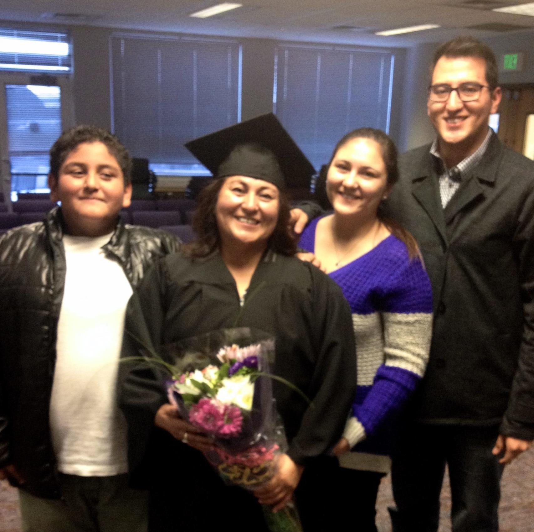 adult learner graduating with family