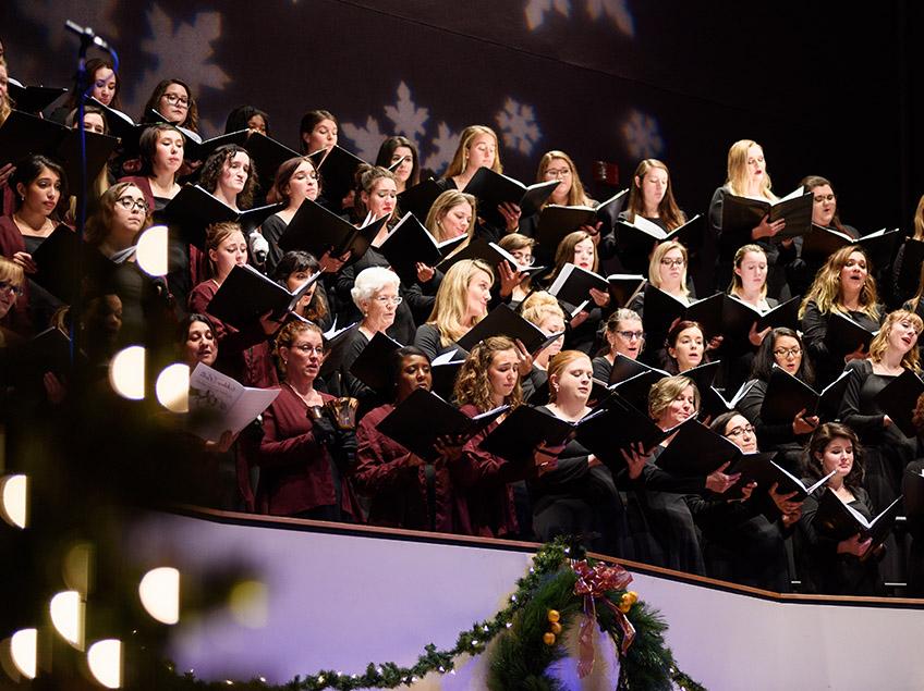 University Treble Choir singing with songbooks