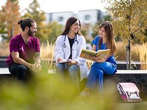 Health care students studying outside